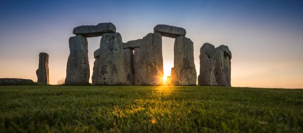 General view of the Stonehenge stone circle during the sunset, near Amesbury, Britain, as seen in this undated image provided to Reuters on July 29, 2020. General view of the Stonehenge stone circle during the sunset, near Amesbury, Britain, as seen in this undated image provided to Reuters on July 29, 2020. - Sputnik International