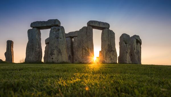 General view of the Stonehenge stone circle during the sunset, near Amesbury, Britain, as seen in this undated image provided to Reuters on July 29, 2020. - Sputnik International