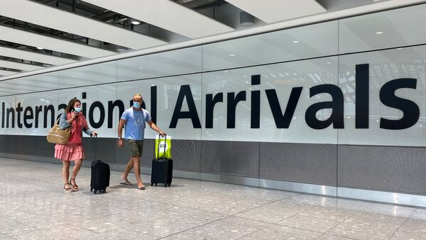 Passengers from international flights arrive at Heathrow Airport, following the outbreak of the coronavirus disease (COVID-19), London, Britain, July 29, 2020. - Sputnik International
