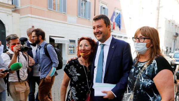 Leader of Italy's League party Matteo Salvini poses with supporters before addressing the upper house of parliament ahead of a vote by senators on whether to allow magistrates to investigate him for refusing a migrant rescue boat permission to land last year when he was interior minister, in Rome, Italy, July 30, 2020.  - Sputnik International