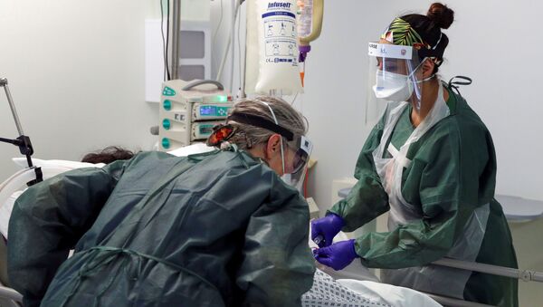 Nurses care for a patient in an Intensive Care ward treating victims of the coronavirus disease (COVID-19) in Frimley Park Hospital in Surrey, Britain, May 22, 2020 - Sputnik International