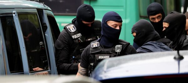 Police officers gather outside during a raid in an apartment building at Kreuzberg district in Berlin, Germany, July 15, 2020. Police officers gather outside during a raid in an apartment building at Kreuzberg district in Berlin, Germany, July 15, 2020. - Sputnik International