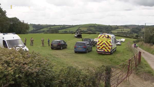 Emergency services and British military officials respond to crash-landing of RAF Chinook helicopter in a field outside of Llangynin, Carmarthenshire, Wales, on July 28, 2020 - Sputnik International