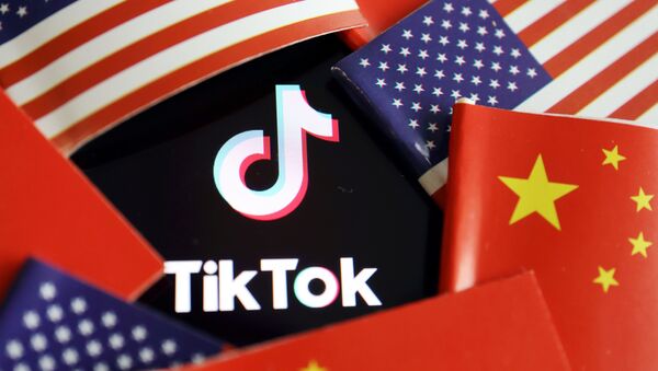 China and U.S. flags are seen near a TikTok logo in this illustration picture taken July 16, 2020 - Sputnik International