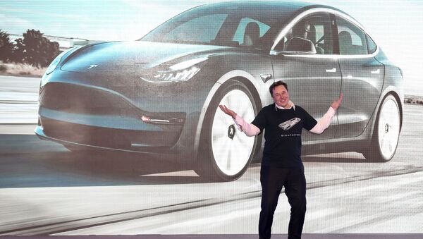 In this file photo taken on January 07, 2020 Tesla CEO Elon Musk gestures during the Tesla China-made Model 3 Delivery Ceremony in Shanghai. - Sputnik International