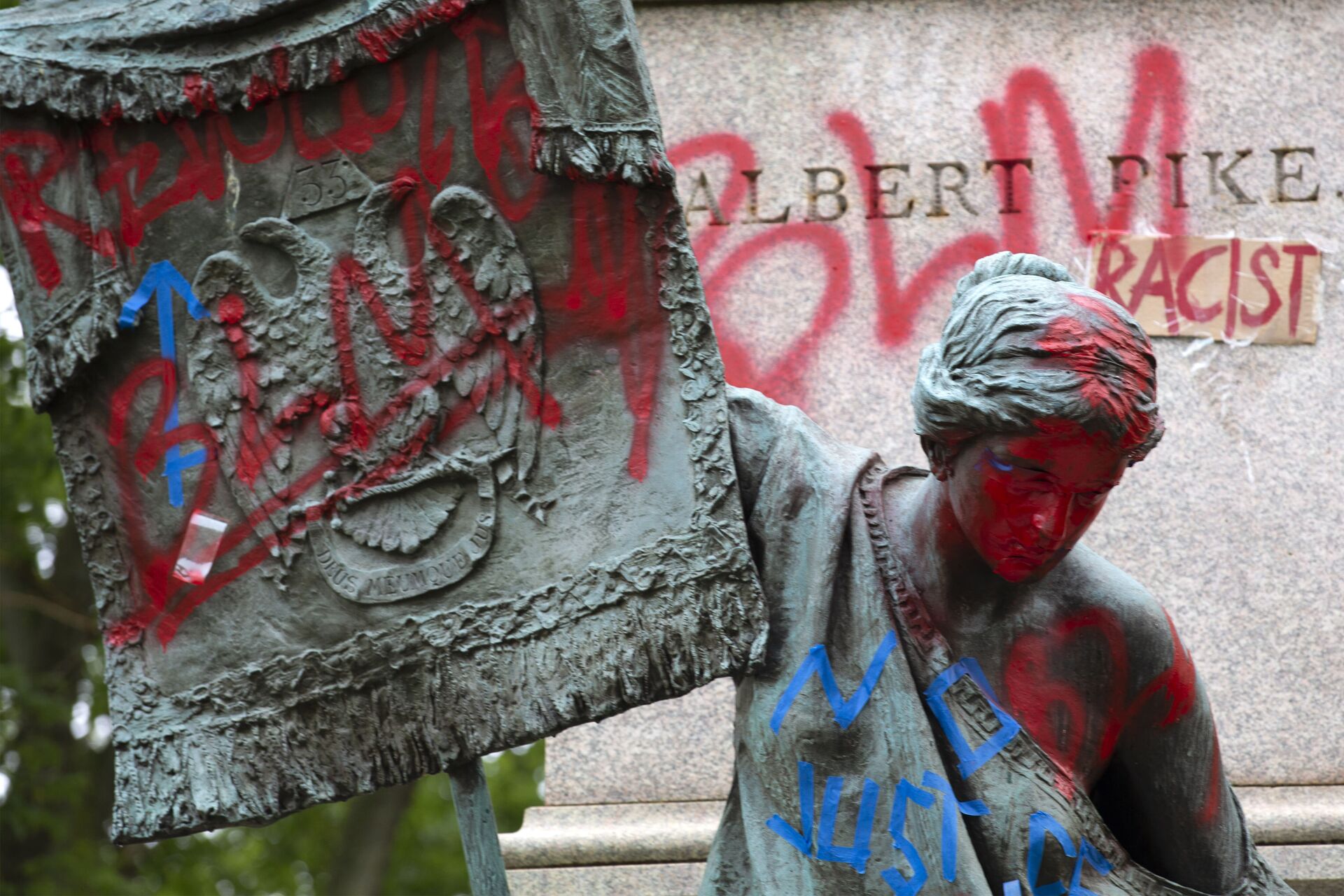 The bronze sculpture representing the Goddess of Masonry on the base of the statue of a Confederate general, Albert Pike, is seen with red paint, after protestors toppled Pike statue's and set on fire early Saturday, June 20, 2020, in Washington. It comes on Juneteenth, the day marking the end of slavery in the United States, amid continuing anti-racism demonstrations following the death of George Floyd in Minneapolis - Sputnik International, 1920, 11.11.2021