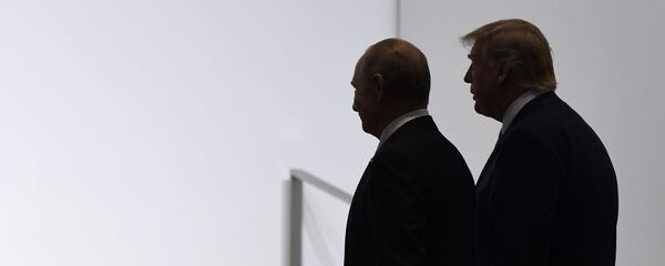President Donald Trump and Russian President Vladimir Putin walk to participate in a group photo at the G20 summit in Osaka, Japan, Friday, June 28, 2019 - Sputnik International
