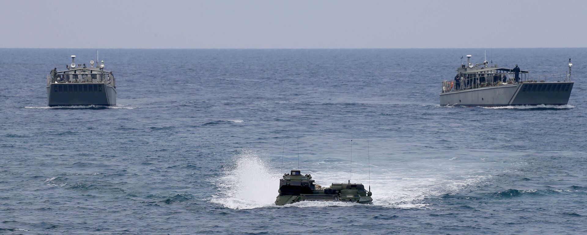 A U.S. Marine Amphibious Assault Vehicle (AAV), with both Philippine and U.S. Marines on board, prepares to storm the beach during an amphibious landing exercise at the two-week joint U.S.-Philippines military exercise dubbed Balikatan 34-2018 Wednesday, May 9, 2018 at the Naval Education and Training Command in Zambales province which is facing the South China Sea in northwestern Philippines. About 8,000 U.S. and Philippine troops are taking part in the annual exercise, the largest since President Rodrigo Duterte came to power - Sputnik International, 1920, 05.04.2023