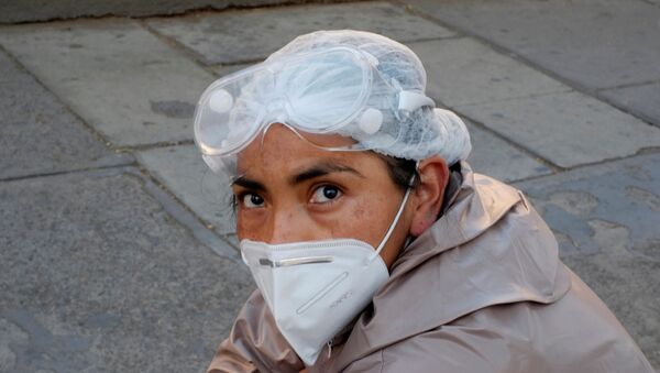A woman wearing a protective suit waits for health information about her relative infected with coronavirus disease (COVID-19) at the Hospital de Clinicas, in La Paz, Bolivia, July 26, 2020. - Sputnik International