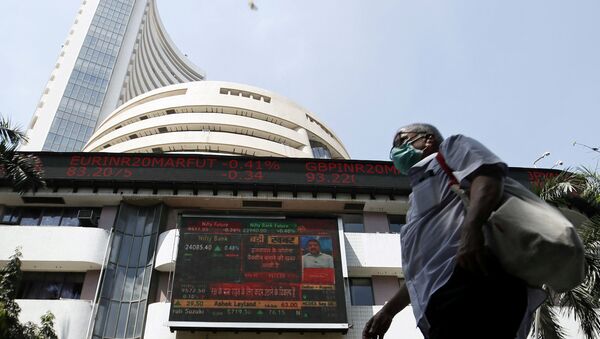 A man wearing a protective mask walks past the Bombay Stock Exchange (BSE) building in Mumbai, India, March 13, 2020 - Sputnik International