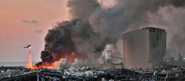 EDITORS NOTE: Graphic content / A helicopter puts out a fire at the scene of an explosion at the port of Lebanon's capital Beirut on August 4, 2020. (Photo by STR / AFP) EDITORS NOTE: Graphic content / A helicopter puts out a fire at the scene of an explosion at the port of Lebanon's capital Beirut on August 4, 2020. (Photo by STR / AFP) - Sputnik International