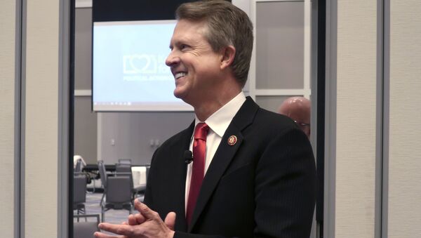 In this Feb. 1, 2020 file photo, U.S. Rep. Roger Marshall, R-Kan., a candidate for the U.S. Senate, awaits the start of a debate in Olathe, Kansas,Establishment Republicans worried heading into Kansas’ primary Tuesday, Aug. 4, 2020 for an open Senate that weeks of effort to thwart polarizing conservative Kris Kobach would falter because they couldn’t persuade President Donald Trump to endorse their favored candidate. - Sputnik International