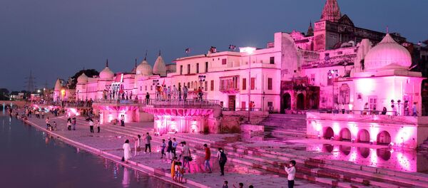 Temples and other buildings on the bank of Sarayu river are seen illuminated ahead of the foundation-laying ceremony for a Hindu temple in Ayodhya, India, August 4, 2019. - Sputnik International