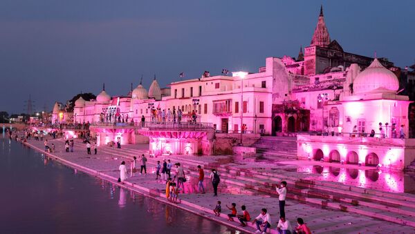 Temples and other buildings on the bank of Sarayu river are seen illuminated ahead of the foundation-laying ceremony for a Hindu temple in Ayodhya, India, August 4, 2019. - Sputnik International