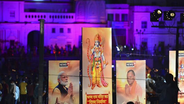 Banners with the images of (L-R) Indian Prime Minister Narendra Modi, Lord Ram and Chief Minister of Uttar Pradesh Yogi Adityanath are seen along the banks of the River Sarayu on the ever before the groundbreaking ceremony of the proposed Ram Temple in Ayodhya on August 4, 2020.  - Sputnik International
