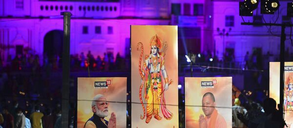 Banners with the images of (L-R) Indian Prime Minister Narendra Modi, Lord Ram and Chief Minister of Uttar Pradesh Yogi Adityanath are seen along the banks of the River Sarayu on the ever before the groundbreaking ceremony of the proposed Ram Temple in Ayodhya on August 4, 2020.  - Sputnik International