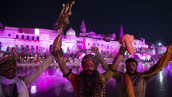 Indian Hindu holy men shout religious slogans on the eve of a groundbreaking ceremony of a temple dedicated to the Hindu god Ram in Ayodhya, India, Tuesday, Aug. 4, 2020 - Sputnik International