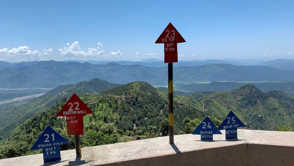 Signs displaying area distance are seen at a hilltop post during a trip organised by the army, near the Line of Control (LoC), in Charikot Sector, Kashmir July 22, 2020 - Sputnik International