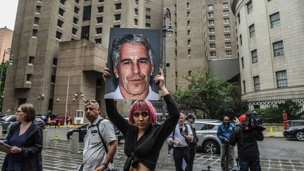 NEW YORK, NY - JULY 08: A member of a protest group called Hot Mess holds up a sign of Jeffrey Epstein in front of the Metropolitan Correction Center on July 8, 2019 in New York City - Sputnik International