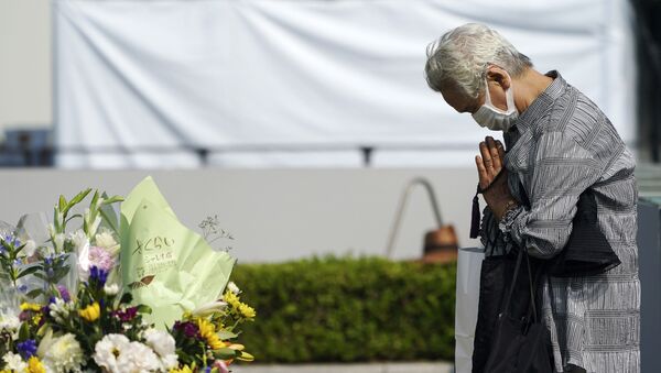 A visitor prays at the cenotaph for the atomic bombing victims near Hiroshima Peace Memorial Museum in Hiroshima, western Japan Wednesday, Aug. 5, 2020. The city of Hiroshima on Thursday, Aug. 6 marks the 75th anniversary of the U.S. atomic bombing. - Sputnik International