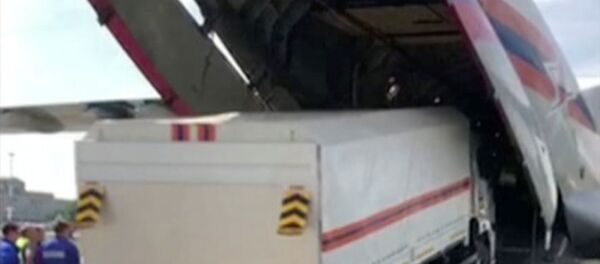 A Russian Emergencies Ministry's truck with humanitarian aid drives into a cargo plane heading to Beirut, a day after a massive explosion in the port of Lebanon's capital, in Moscow Region, Russia, in this still image from handout video taken August 5, 2020 A Russian Emergencies Ministry's truck with humanitarian aid drives into a cargo plane heading to Beirut, a day after a massive explosion in the port of Lebanon's capital, in Moscow Region, Russia, in this still image from handout video taken August 5, 2020 - Sputnik International