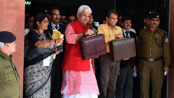 Indian Railways Minister Suresh Prabhu (3R) leaves his office with Minister of State for Railways, Manoj Sinha (C/RED) for the Indian parliament to present the railway budget in New Delhi on February 26, 2015 - Sputnik International