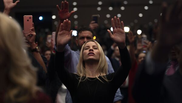 Supporters pray as US President Donald Trump speaks during a 'Evangelicals for Trump' campaign event held at the King Jesus International Ministry on January 03, 2020 in Miami, Florida - Sputnik International