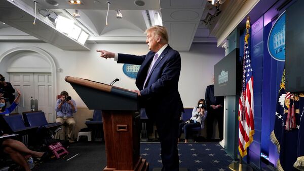 U.S. President Donald Trump points to a reporter as he holds a coronavirus disease (COVID-19) pandemic briefing in the Brady Press Briefing Room of the White House in Washington, U.S., August 5, 2020 - Sputnik International