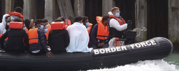 A British Border Force vessel carries a group of men thought to be migrants into Dover harbour, Southern England, Tuesday Aug. 4, 2020 A British Border Force vessel carries a group of men thought to be migrants into Dover harbour, Southern England, Tuesday Aug. 4, 2020 - Sputnik International