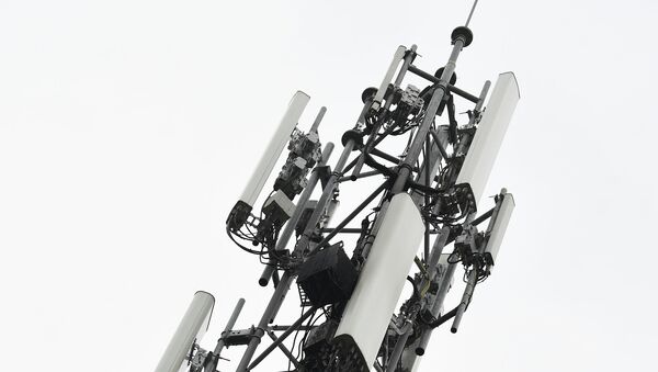 A 5G mast erected by telecom operator 'Proximus' that was set on fire, in Peltheide, Limburg province on the eve of April 19, 2020. A fake theory circulating on social media claiming the radiation of 5G masts has been linked to the noval coronavirus, COVID-19, that has swept across the continents killing many thousands of people. - Sputnik International