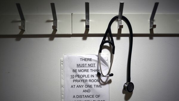 In this Thursday, May 14, 2020 photo, a stethoscope hangs on a coat hook at the entrance to the Muslim prayer room, at the Royal Blackburn Teaching Hospital, in Blackburn, England, amid the coronavirus pandemic - Sputnik International