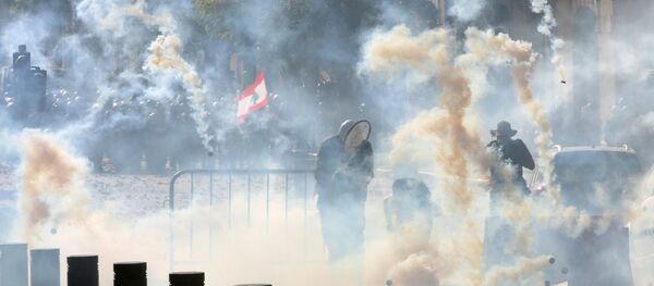 Riot police fire tear gas at demonstrators during a protest, following Tuesday's blast, in Beirut, Lebanon August 8, 2020. Riot police fire tear gas at demonstrators during a protest, following Tuesday's blast, in Beirut, Lebanon August 8, 2020. - Sputnik International