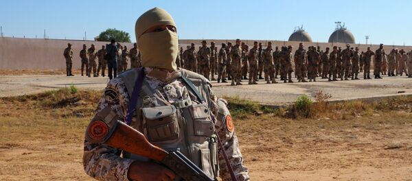 Members of the Petroleum Facilities Guard are seen at the Azzawiya oil refinery, in Zawiyah, west of Tripoli, Libya July 23, 2020. Members of the Petroleum Facilities Guard are seen at the Azzawiya oil refinery, in Zawiyah, west of Tripoli, Libya July 23, 2020. - Sputnik International