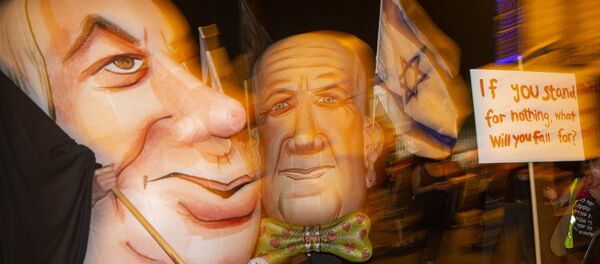 Demonstrators wear masks depicting Israel's Prime Minister Benjamin Netanyahu, left, and Defense Minister and coalition partner Benny Gantz, right, during a protest against Israel's Prime Minister outside his residence in Jerusalem, Israel, Saturday, 8 August 2020. Demonstrators wear masks depicting Israel's Prime Minister Benjamin Netanyahu, left, and Defense Minister and coalition partner Benny Gantz, right, during a protest against Israel's Prime Minister outside his residence in Jerusalem, Israel, Saturday, 8 August 2020. - Sputnik International