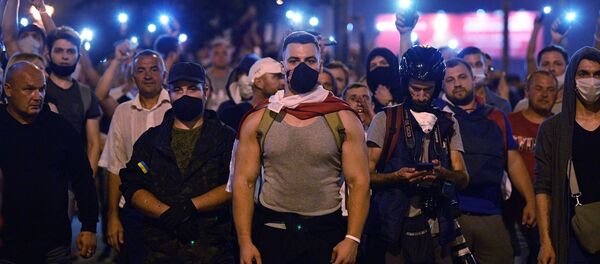 Protesters took to the streets of Minsk on Sunday night after official exit polls projected a landslide victory for the incumbent President Lukashenko - Sputnik International