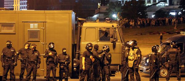 Riot police block an area during a protest of opposition supporters after polls closed in the presidential election, in Minsk on August 9, 2020. - Sputnik International