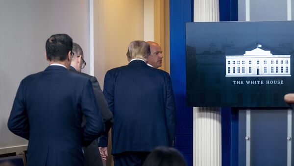 President Donald Trump is asked to leave the James Brady Press Briefing Room by a member of the U.S. Secret Service during a news conference at the White House, Monday, Aug. 10, 2020. - Sputnik International