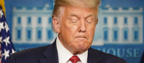 U.S. President Donald Trump holds during a coronavirus disease (COVID-19) pandemic briefing at the White House in Washington, U.S., August 10, 2020. U.S. President Donald Trump holds during a coronavirus disease (COVID-19) pandemic briefing at the White House in Washington, U.S., August 10, 2020. - Sputnik International