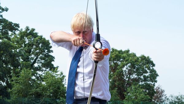 Britain's Prime Minister Boris Johnson takes part in an archery session as he visits Premier Education Summer Camp at Sacred Heart of Mary Girls' School, as the coronavirus disease (COVID-19) outbreak continues, in Upminster, London, Britain August 10, 2020. - Sputnik International