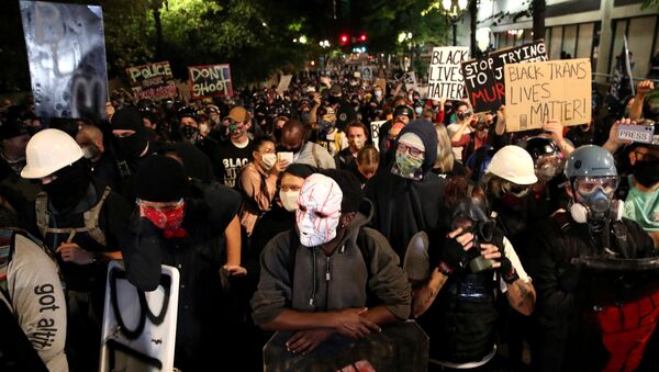 Demonstrators attend a protest against racial inequality and police violence in Portland, Oregon, U.S., August 2, 2020 - Sputnik International