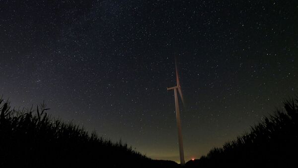 In this photo taken with long exposure, a wind turbine is set against a starry sky Thursday, Aug. 13, 2015, near Marshalltown, Iowa. The annual Perseid meteor shower reaches its peak on Wednesday and Thursday - Sputnik International
