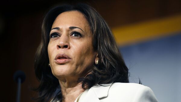 Sen. Kamala Harris, D-Calif., talks to reporters about the impeachment trial of President Donald Trump on charges of abuse of power and obstruction of Congress, at the Capitol in Washington, Thursday, Jan. 16, 2020 - Sputnik International