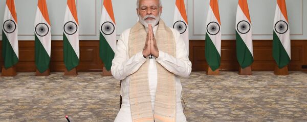 In this photo released by India Government Press Information Bureau, Indian Prime Minister Narendra Modi pays tributes to  Indian soldiers killed during confrontation with Chinese soldiers in the Ladakh region as he holds a video conference with chief ministers, in New Delhi, India, June 17, 2020 - Sputnik International