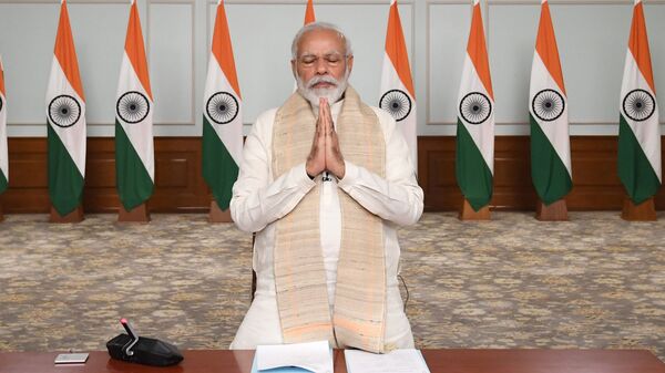 In this photo released by India Government Press Information Bureau, Indian Prime Minister Narendra Modi pays tributes to  Indian soldiers killed during confrontation with Chinese soldiers in the Ladakh region as he holds a video conference with chief ministers, in New Delhi, India, June 17, 2020 - Sputnik International