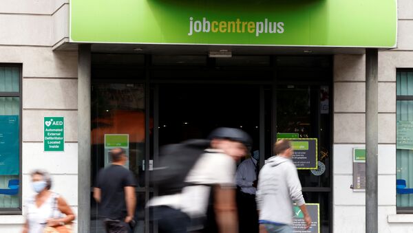 People walk past a branch of Jobcentre Plus, a government run employment support and benefits agency, as the outbreak of the coronavirus disease (COVID-19) continues, in Hackney, London, Britain, August 6, 2020 - Sputnik International
