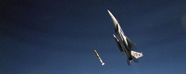 An air-to-air left side view of an F-15 Eagle aircraft releasing an anti-satellite (ASAT) missile during a test on Sep. 13, 1985, at the Pacific Missile Test Range, CA - Sputnik International