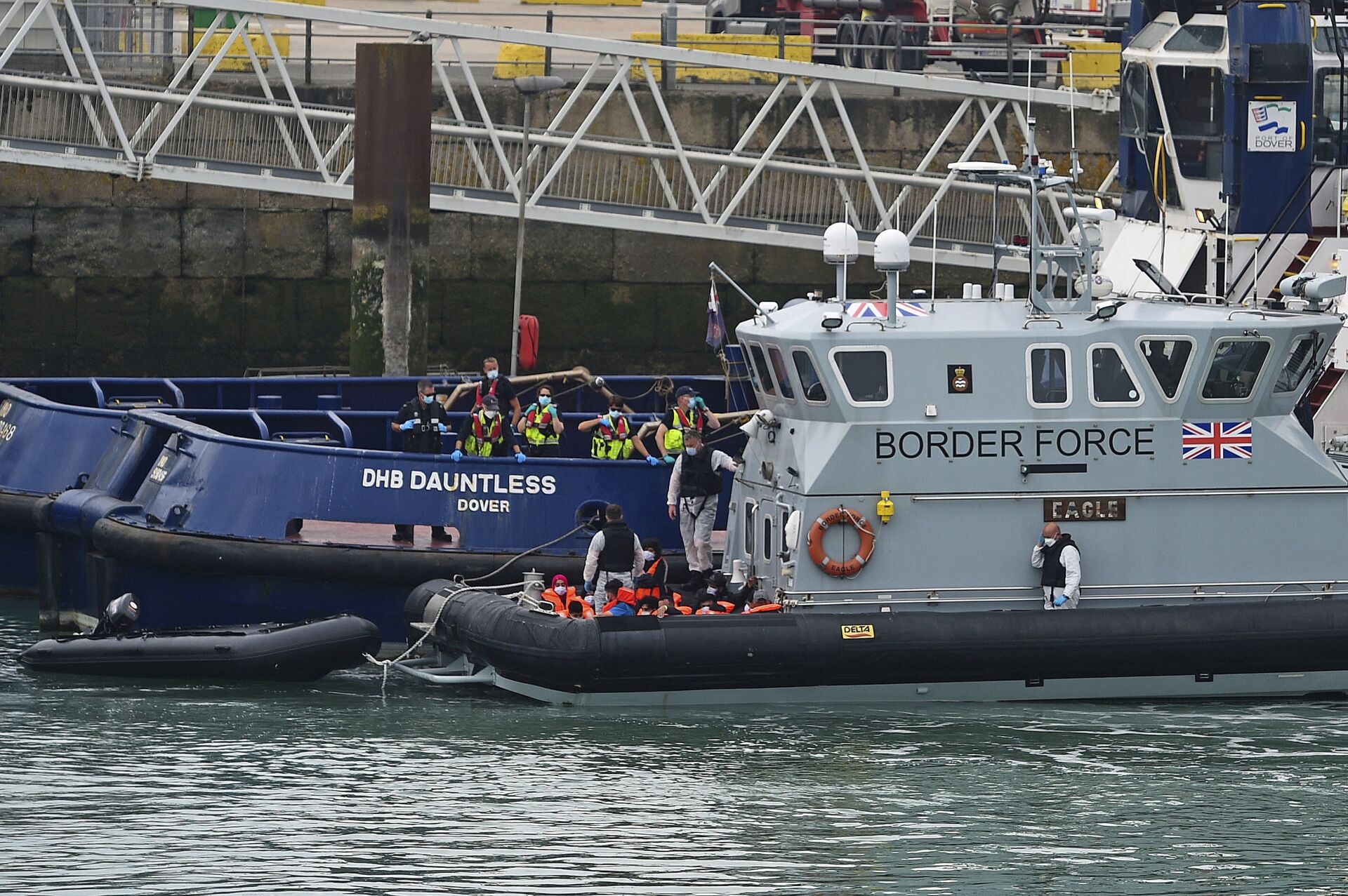 A group of people thought to be migrants are brought into Dover, England, Wednesday Aug. 12, 2020, by Border Force officers. (Kirsty O'Connor/PA via AP) - Sputnik International, 1920, 15.11.2021