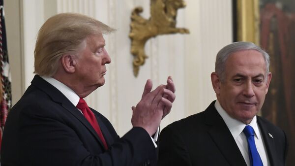 President Donald Trump, left, listens as Israeli Prime Minister Benjamin Netanyahu, right, speaks during an event in the East Room of the White House in Washington, Tuesday, Jan. 28, 2020, to announce the Trump administration's much-anticipated plan to resolve the Israeli-Palestinian conflict.  - Sputnik International