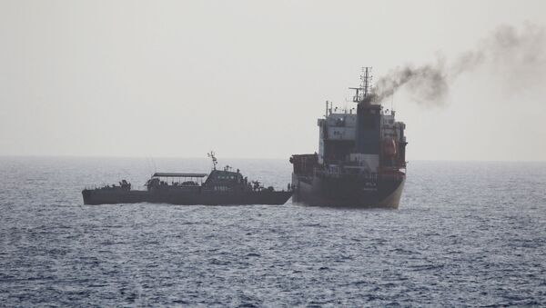 In this Wednesday, 12 August 2020 photo released by the US Navy, the MT Wila is boarded by Iranian navy commandos in the Gulf of Oman off the eastern coast of the United Arab Emirates. The Iranian navy boarded and briefly seized a Liberian-flagged oil tanker near the strategic Strait of Hormuz amid heightened tensions between Tehran and the U.S., a U.S. military official said Thursday, 13 August 2020. (US Navy via AP) - Sputnik International
