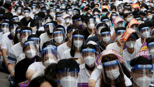 Medical residents and doctors attend a 24-hour strike amid the coronavirus disease (COVID-19) pandemic to protest a government plan to increase medical school admissions by 400 a year for the next decade to prepare for potential infectious disease outbreaks, in Seoul, South Korea, August 14, 2020 - Sputnik International